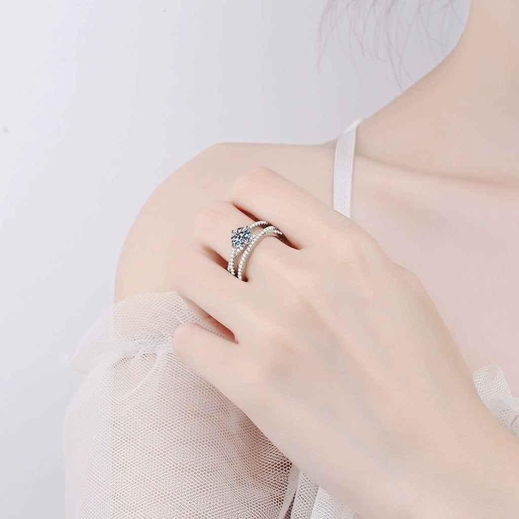 Split Shank Round Moissanite Ring with CZ worn on hand by model