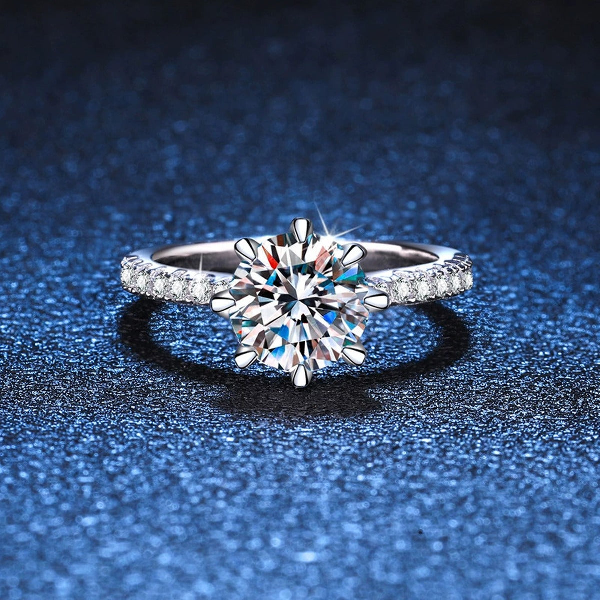 Round Moissanite Solitaire Ring with CZ blue background product view
