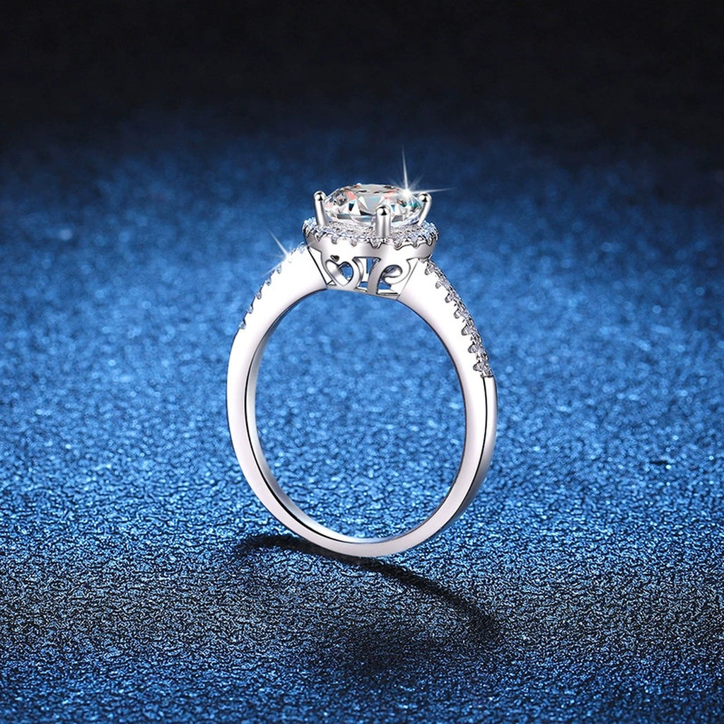 Round Halo Moissanite Engagement Ring with CZ blue background product view