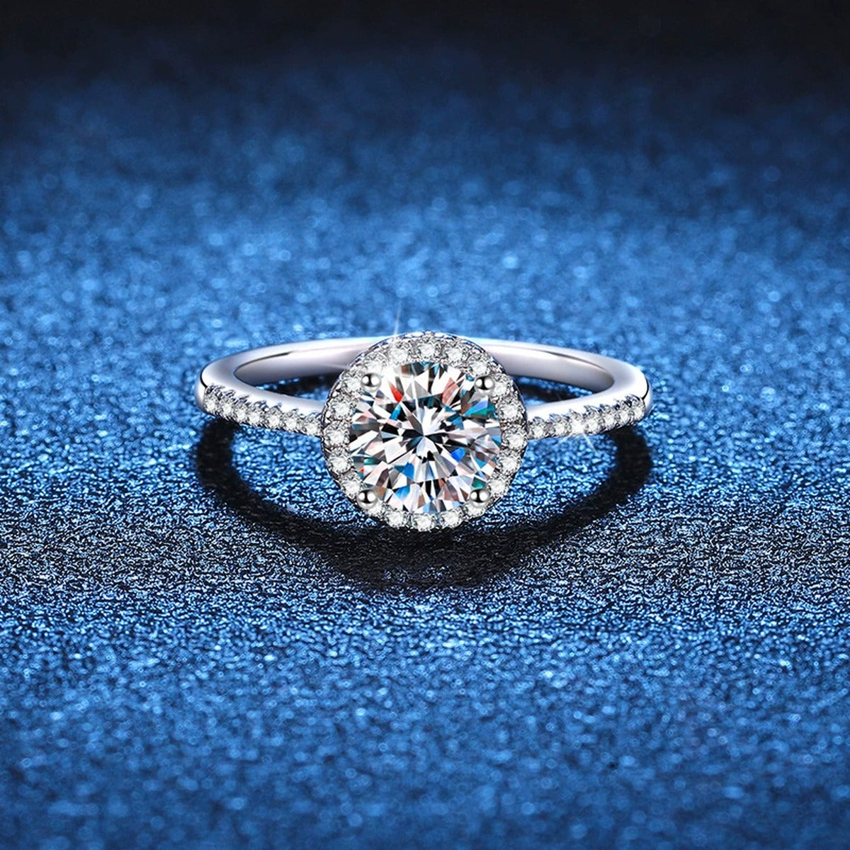 Round Halo Moissanite Engagement Ring with CZ blue background product view