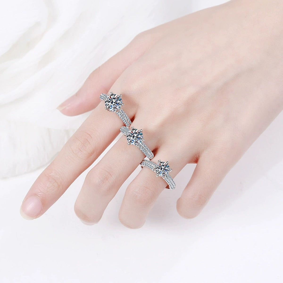Split Shank Round Moissanite Ring with CZ worn on hand by model