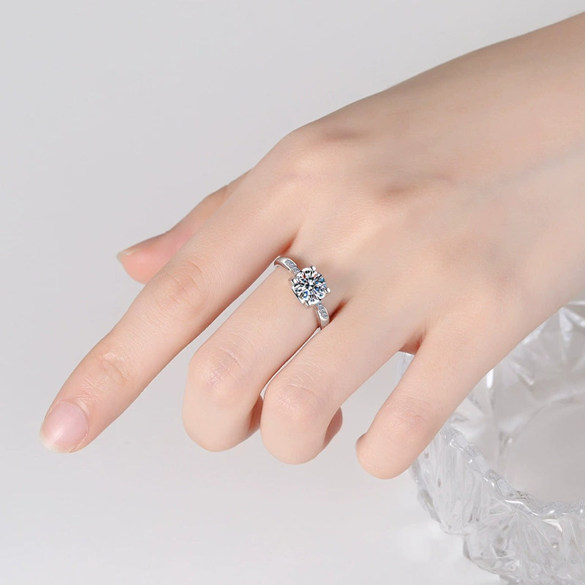 Round Moissanite Solitaire Ring with CZ worn on hand by model