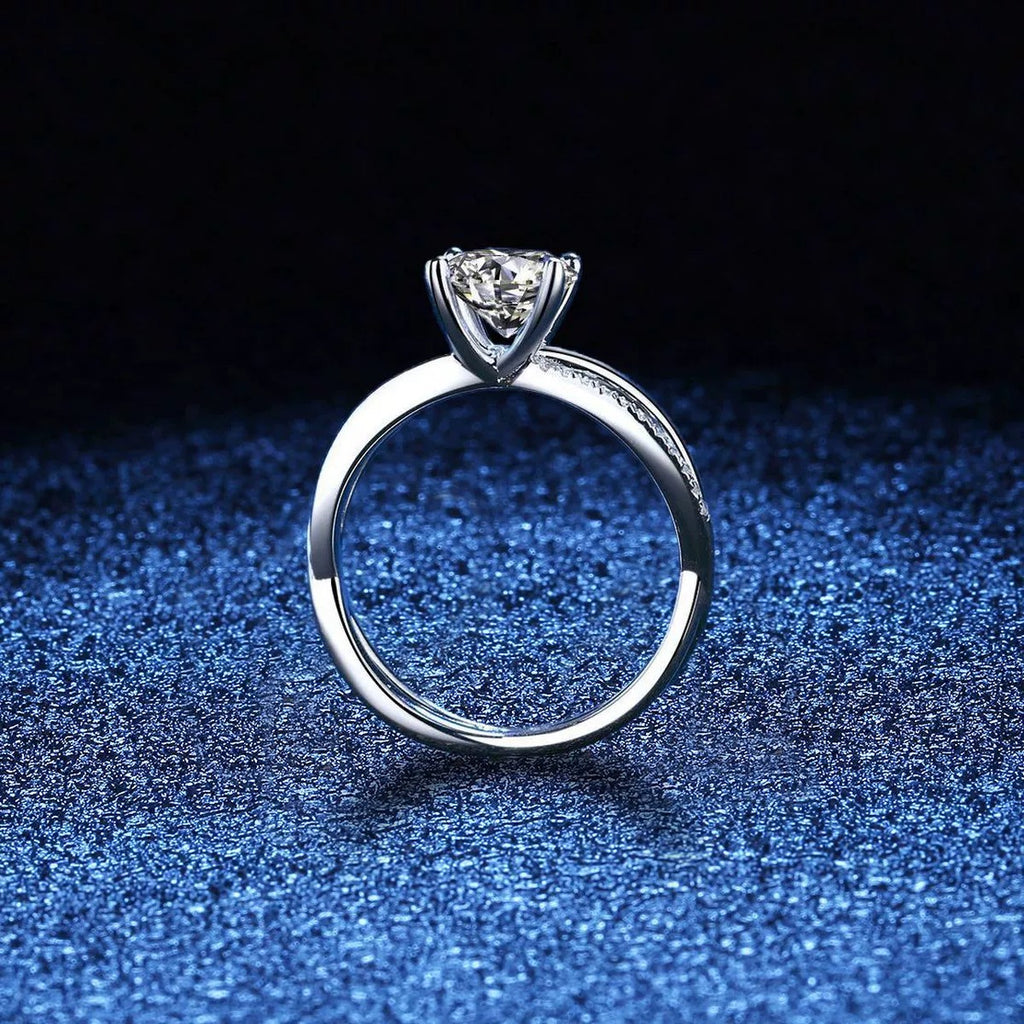 Interlocking Round Moissanite Ring with CZ blue background product view