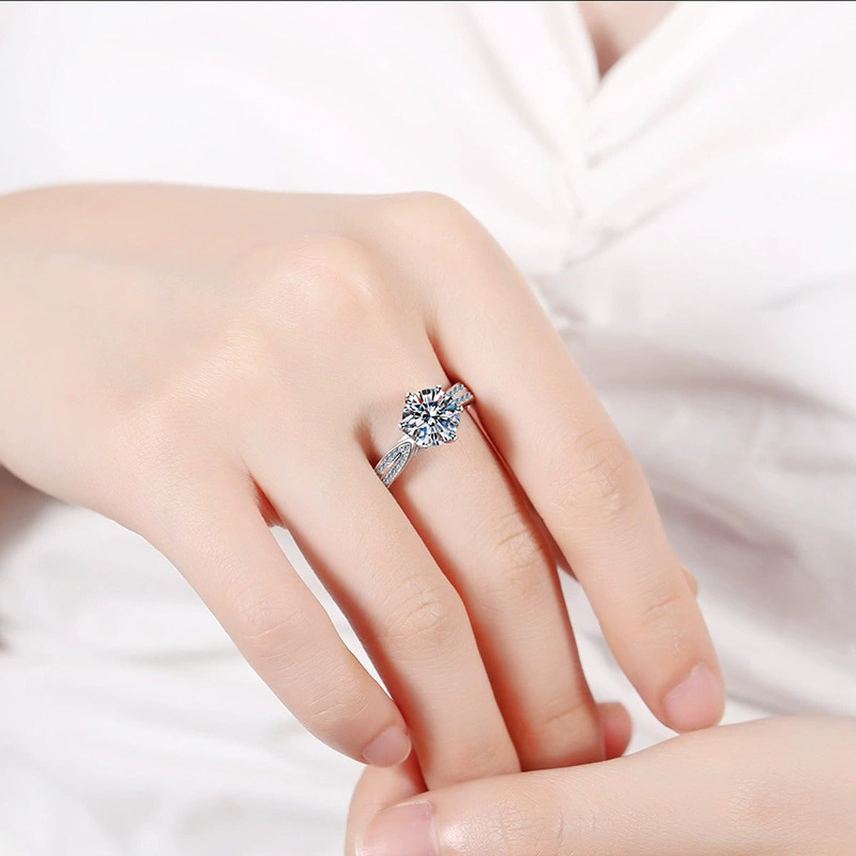 Round Moissanite Solitaire Ring with CZ worn on hand by model