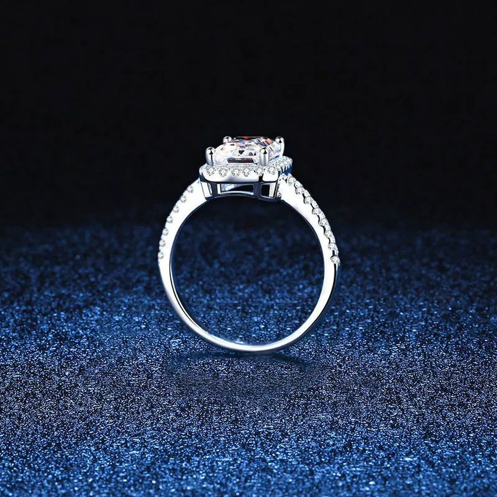 Emerald and Radiant Cut Moissanite Ring with CZ blue background product view