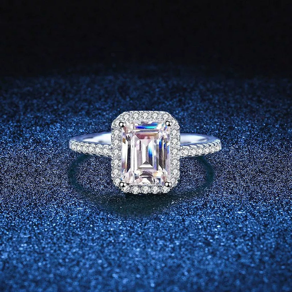 Emerald and Radiant Cut Moissanite Ring with CZ blue background product view