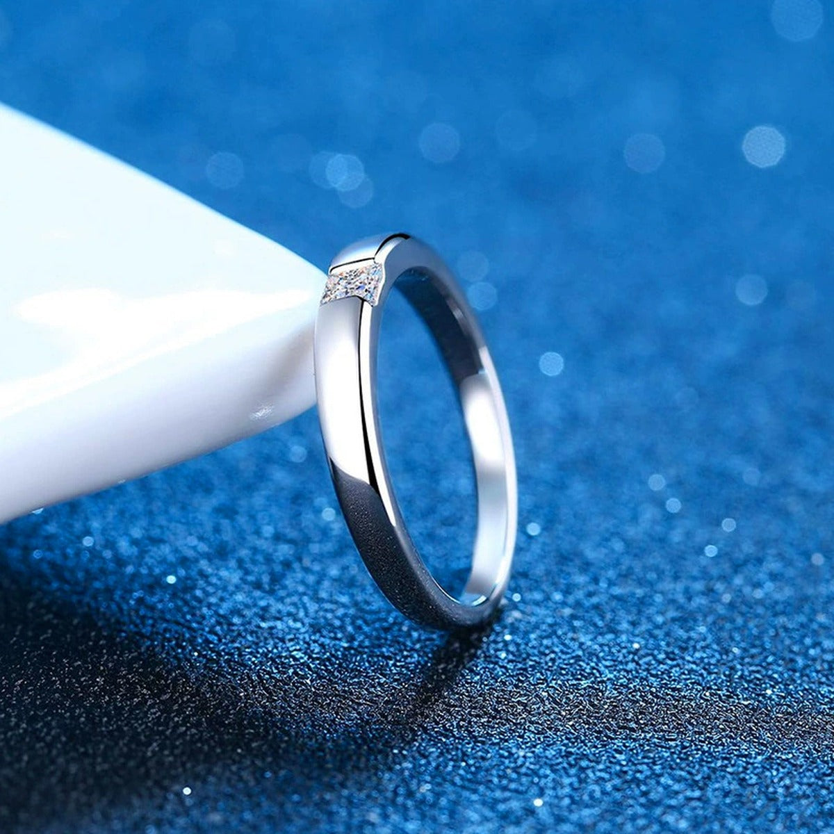 Bezel Moissanite Band Ring with CZ blue background product view