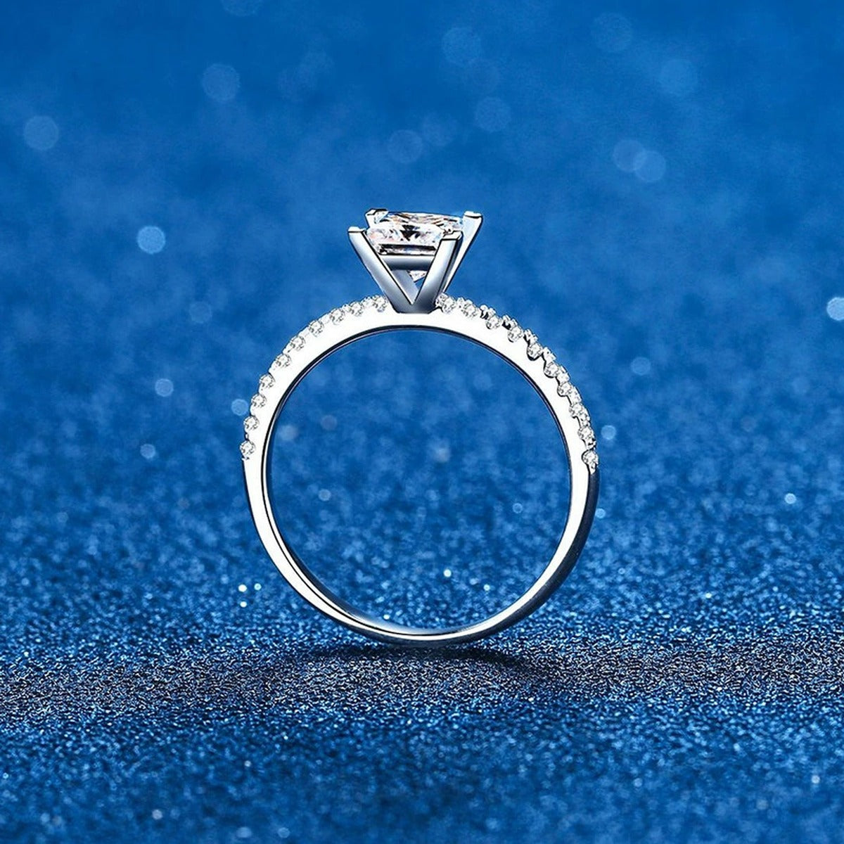 Princess Cut Moissanite Ring with CZ blue background product view