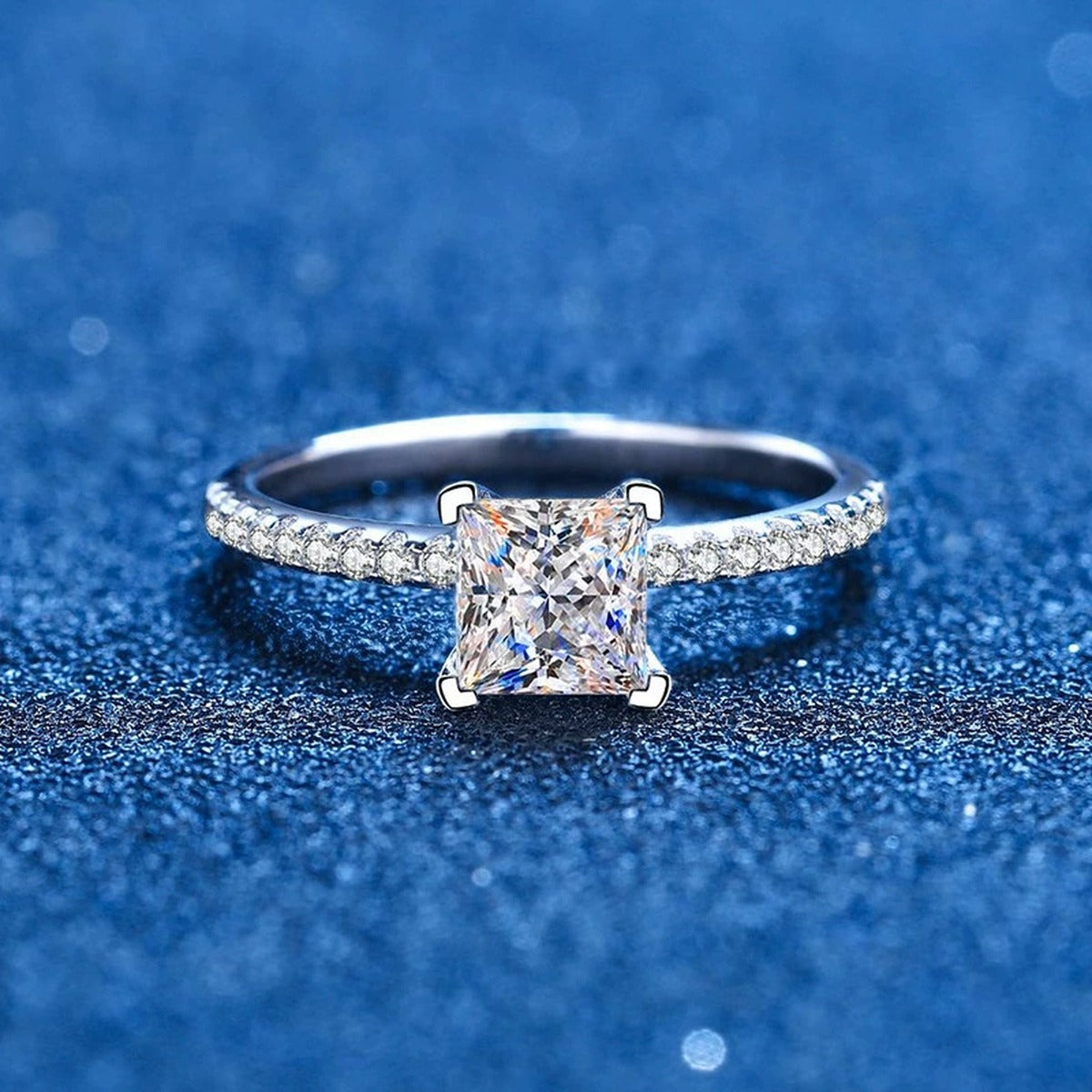Princess Cut Moissanite Ring with CZ blue background product view