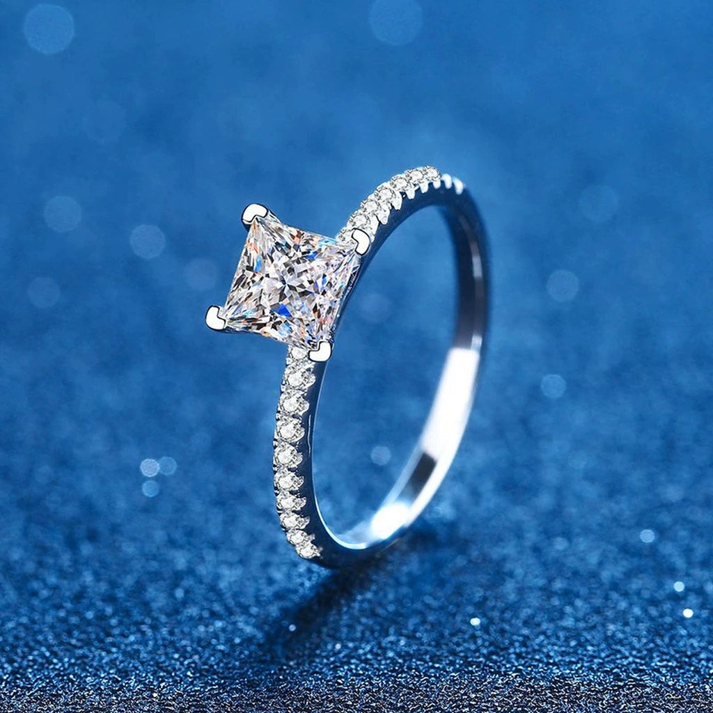 Princess Cut Moissanite Ring with CZ blue background product view