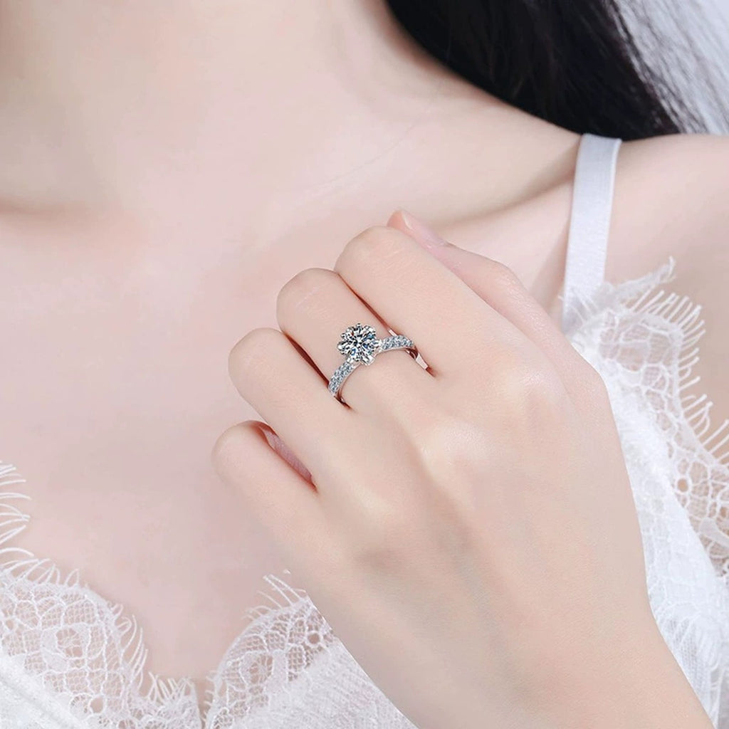 Round Halo Moissanite Engagement Ring with CZ worn on hand by model