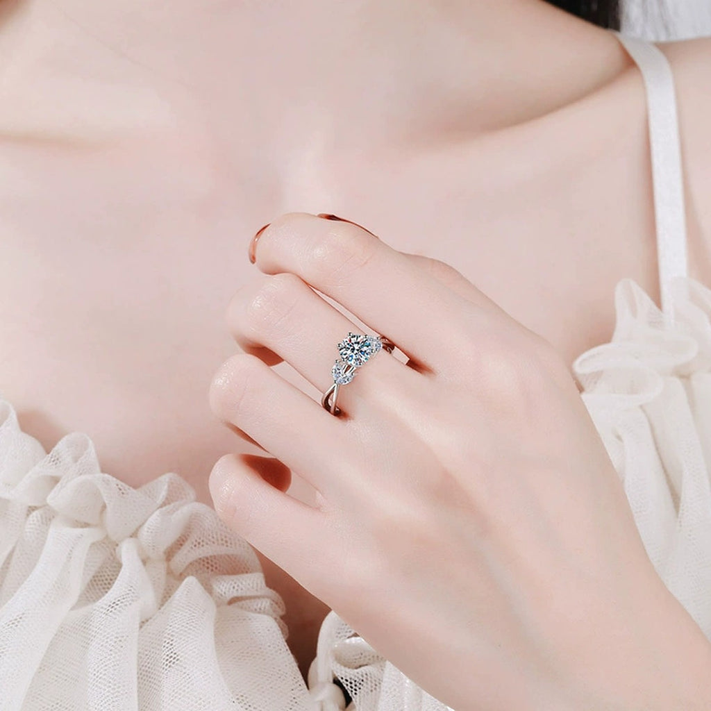 Floral Round Moissanite Ring with CZ worn on hand by model