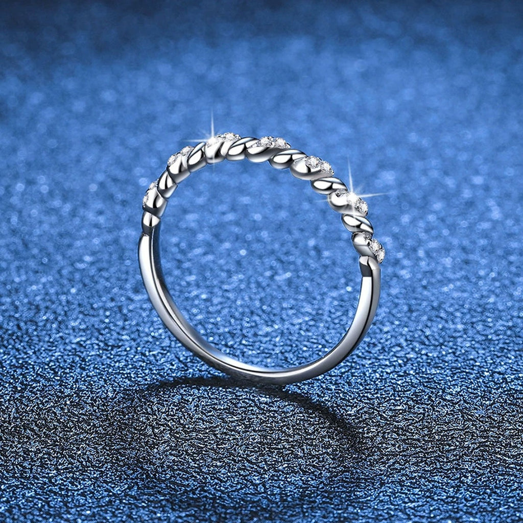 Twisted Moissanite Band Ring blue background product view
