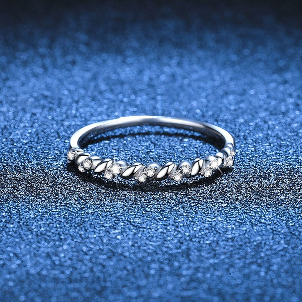 Twisted Moissanite Band Ring blue background product view