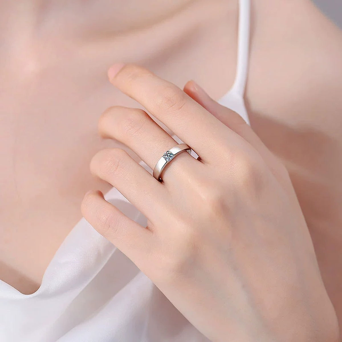 Bezel Set Moissanite Band Ring with CZ worn on hand by model