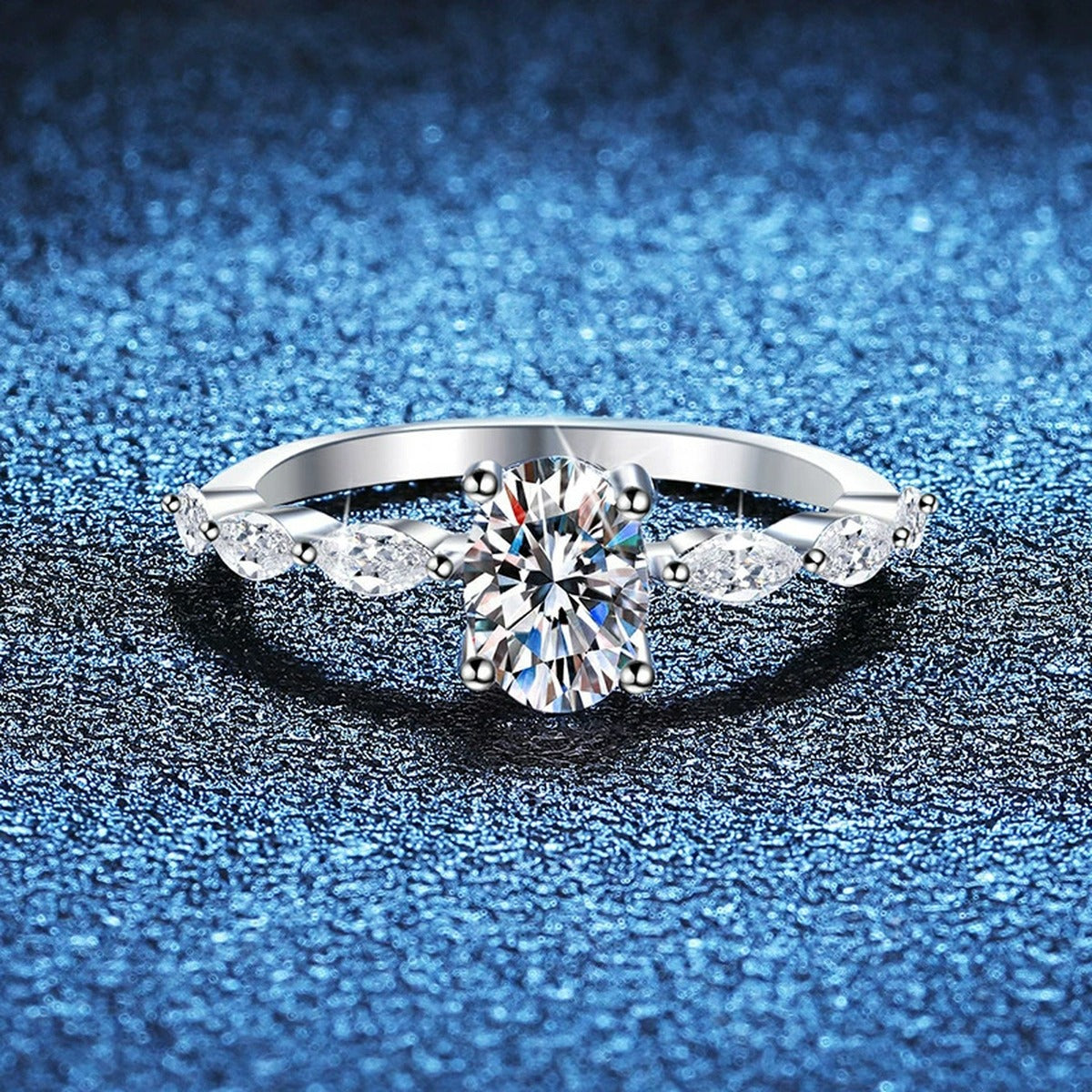 Pear Shaped Moissanite Ring with CZ blue background product view