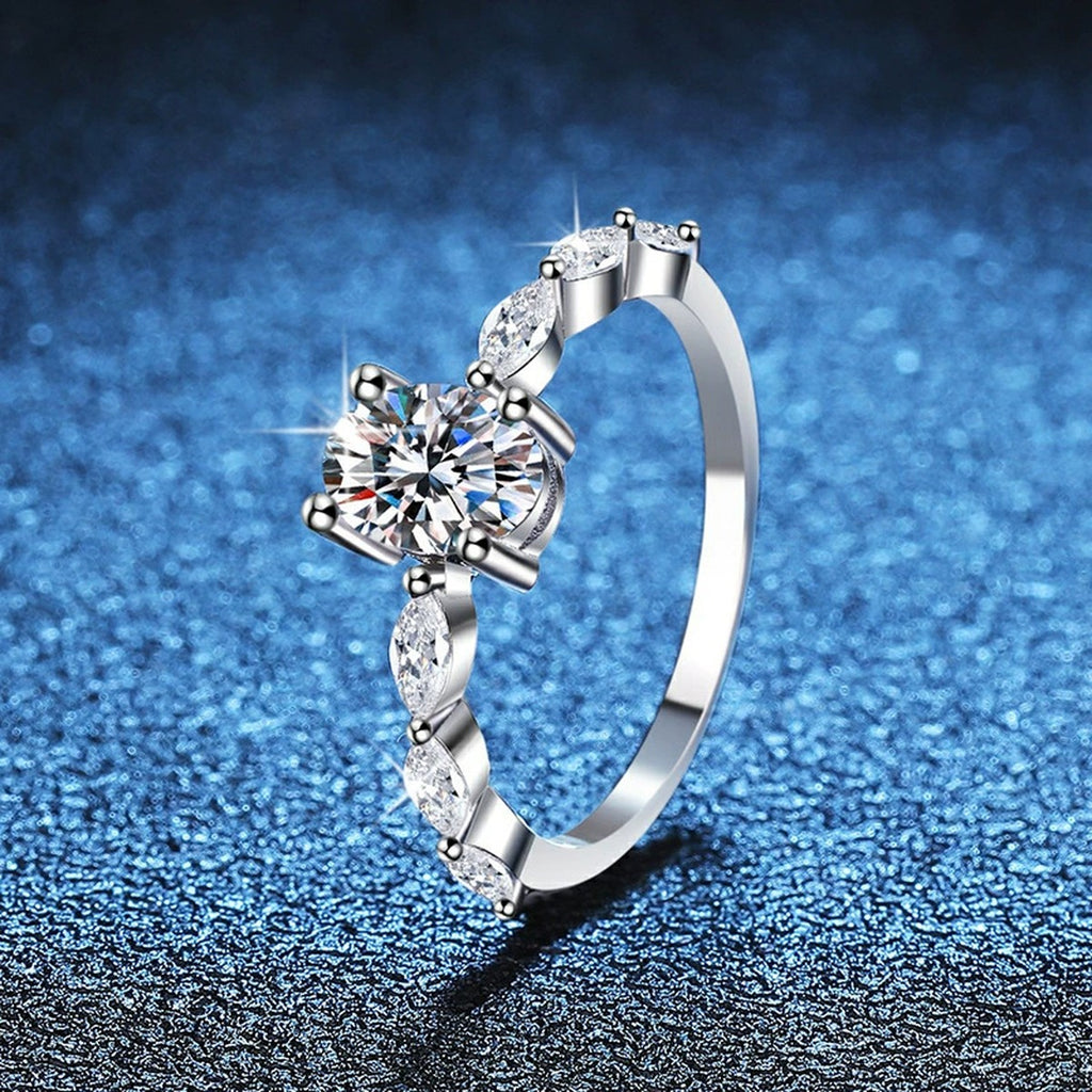 Pear Shaped Moissanite Ring with CZ blue background product view