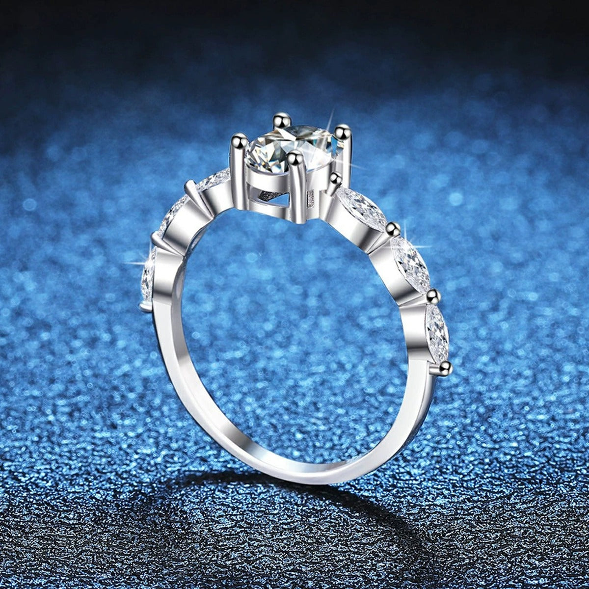 Pear Shaped Moissanite Ring with CZ blue background product view
