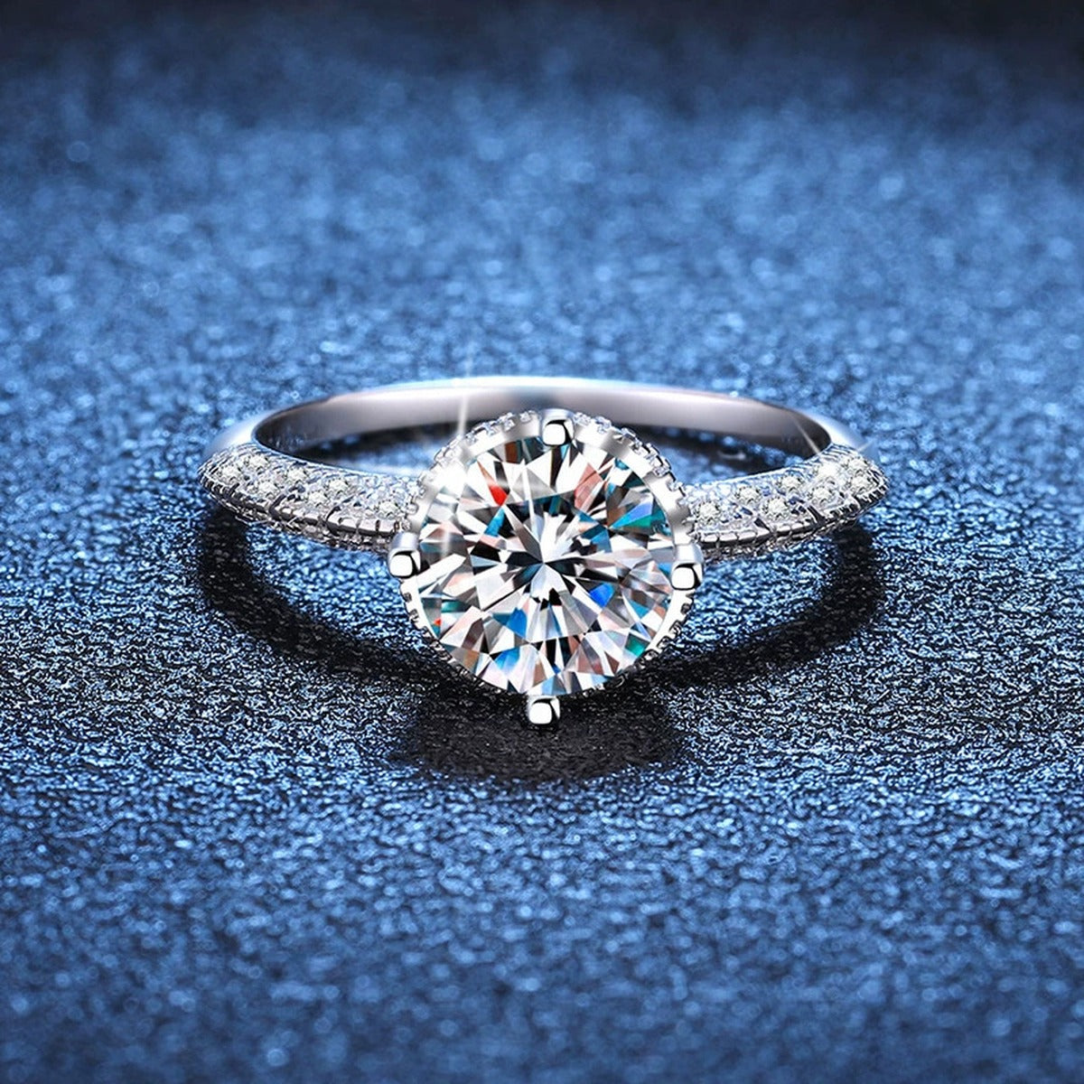 Round Moissanite Ring with Pink CZ blue background product view