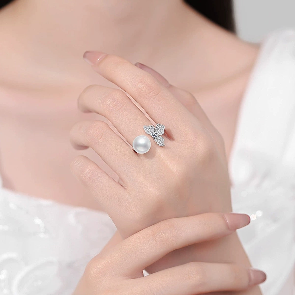 Pearl and Moissanite Bow Adjustable Ring with CZ in White Gold-Plated S925 Sterling Silver worn by model