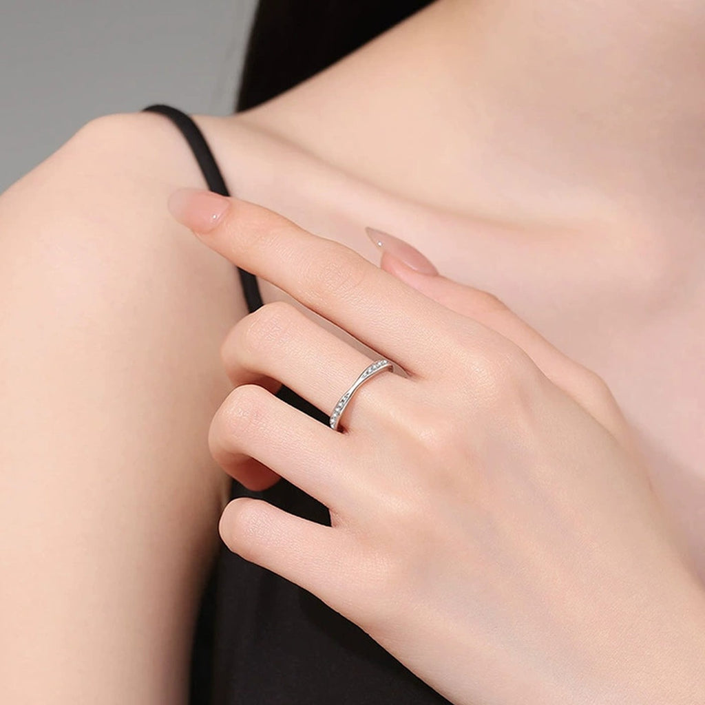Slim Moissanite Band Ring worn on hand by model