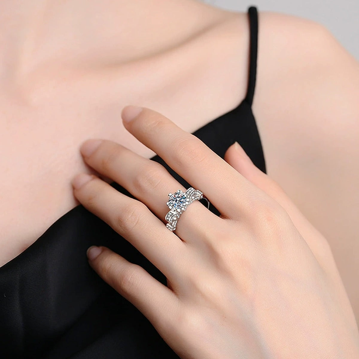 Round Moissanite Ring with CZ worn on hand by model