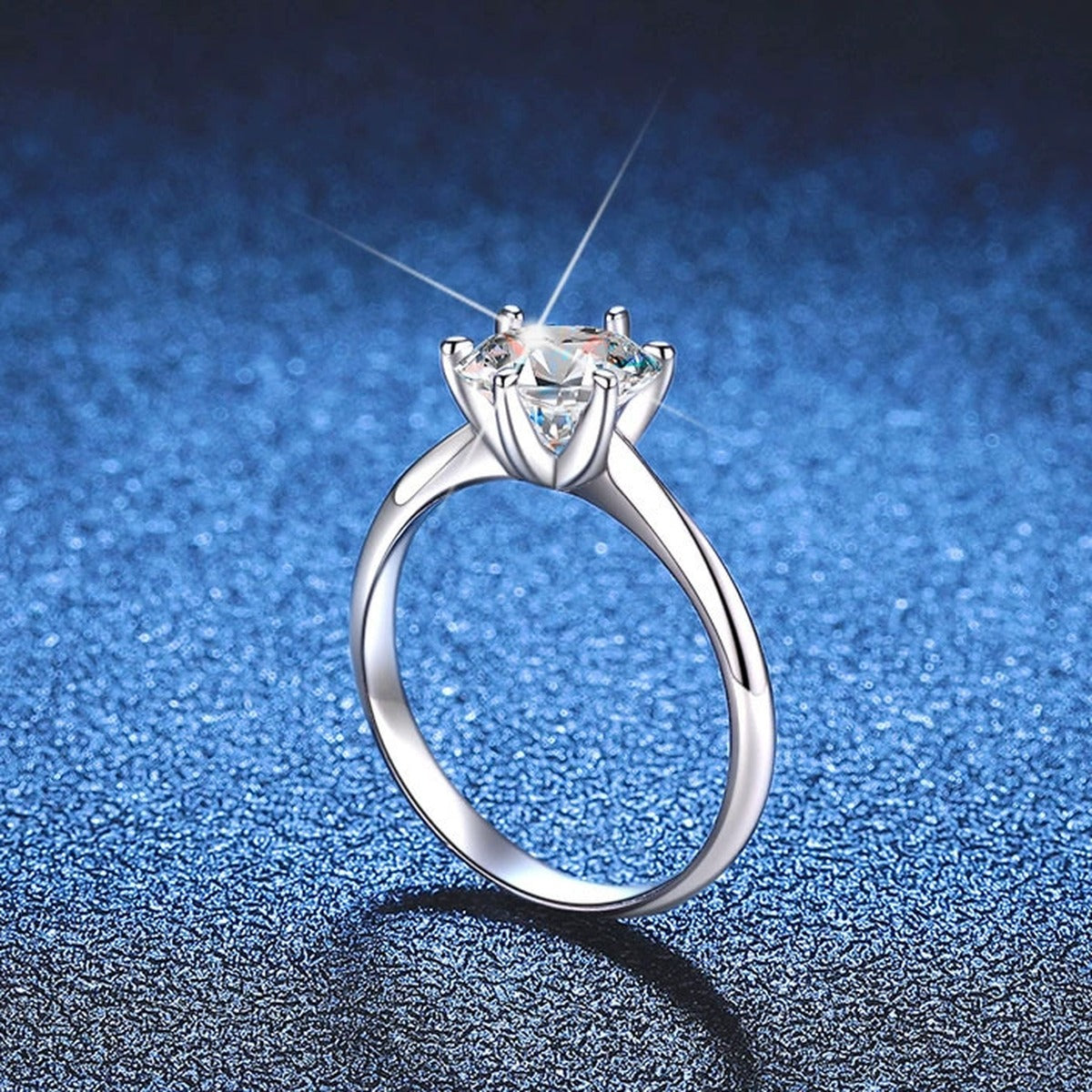 Round Moissanite Solitaire Ring blue background product view