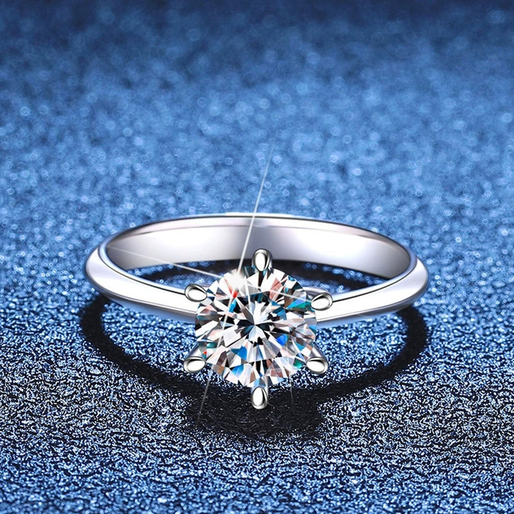 Round Moissanite Solitaire Ring blue background product view