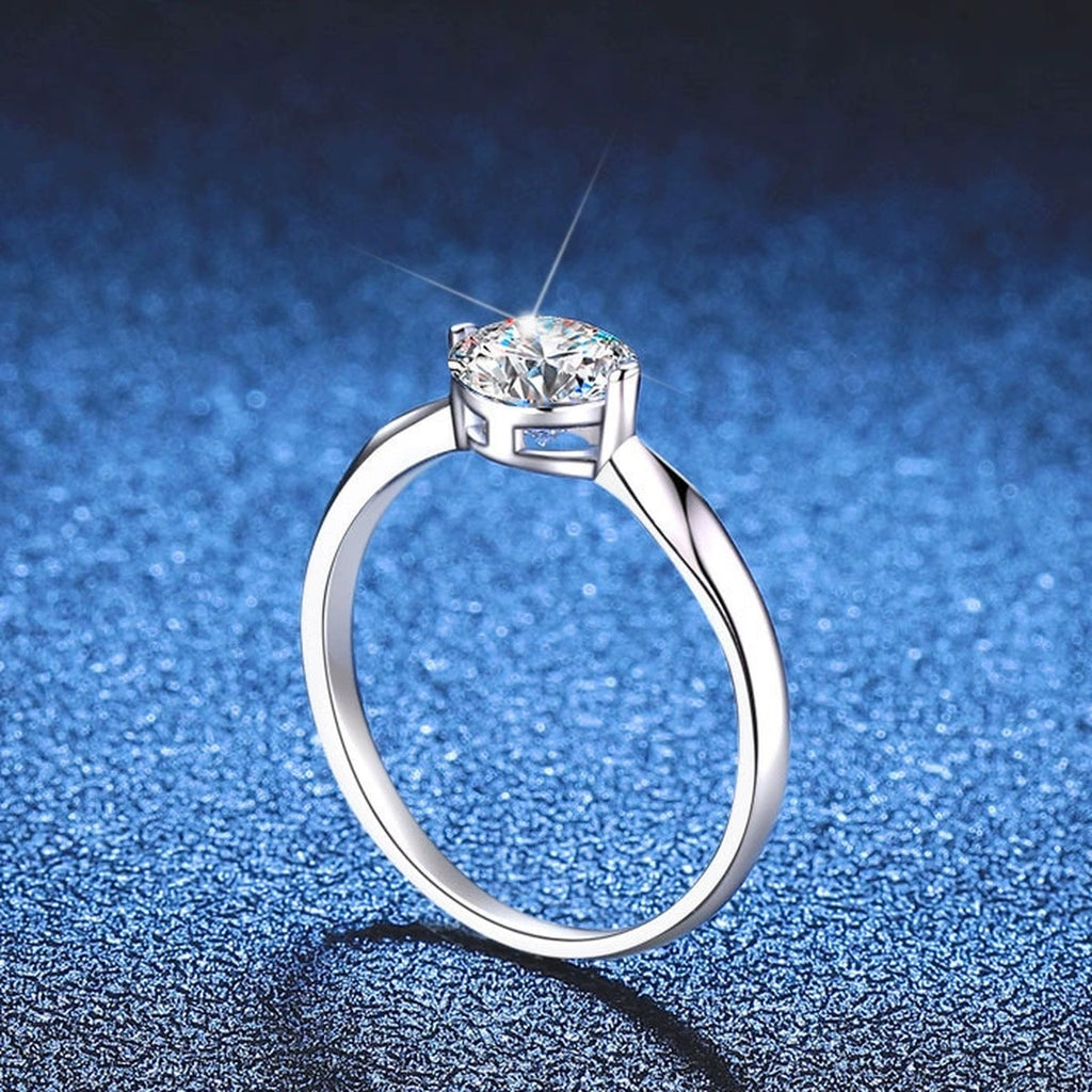 Round Moissanite Solitaire Ring blue background product view