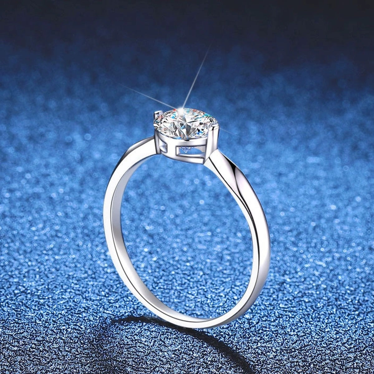 Round Moissanite Solitaire Ring blue background product view