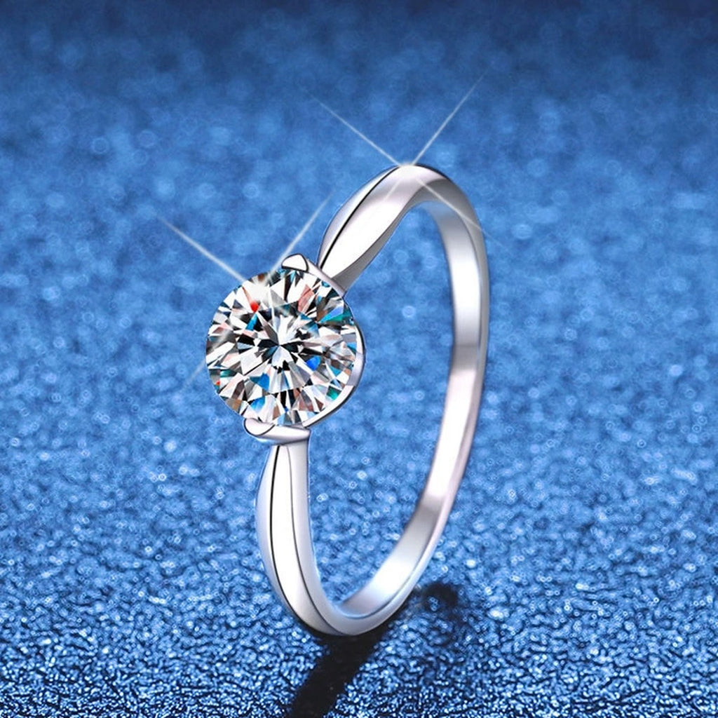 Round Moissanite Solitaire Ring blue background product view
