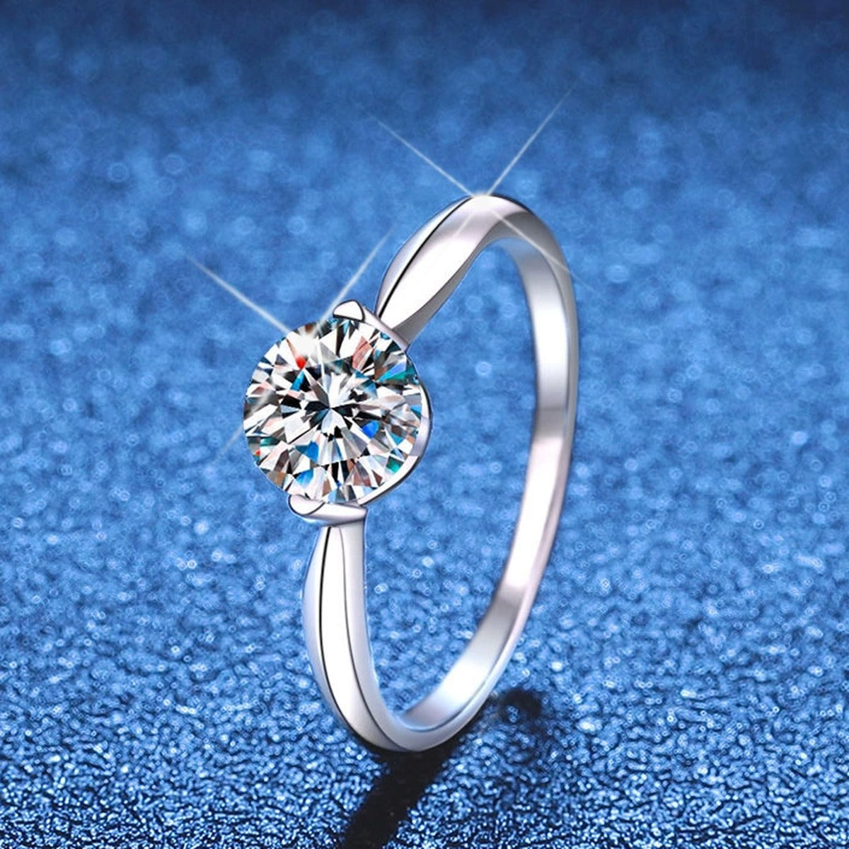 Round Moissanite Solitaire Ring blue background product view