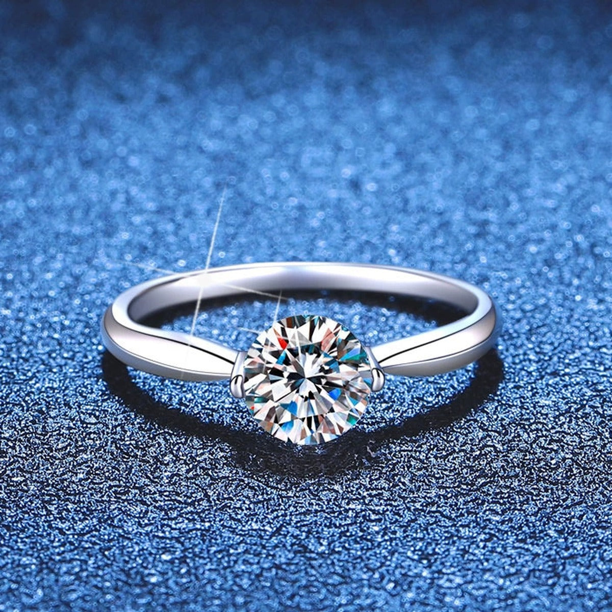 Round Moissanite Solitaire Ring blue background product view