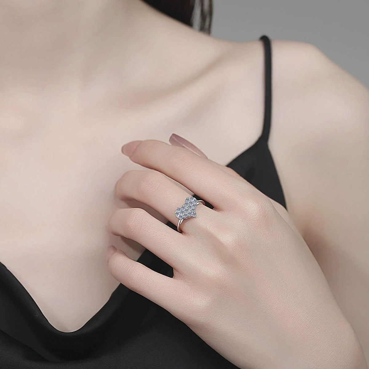 Floral Cluster Moissanite Ring worn on hand by model