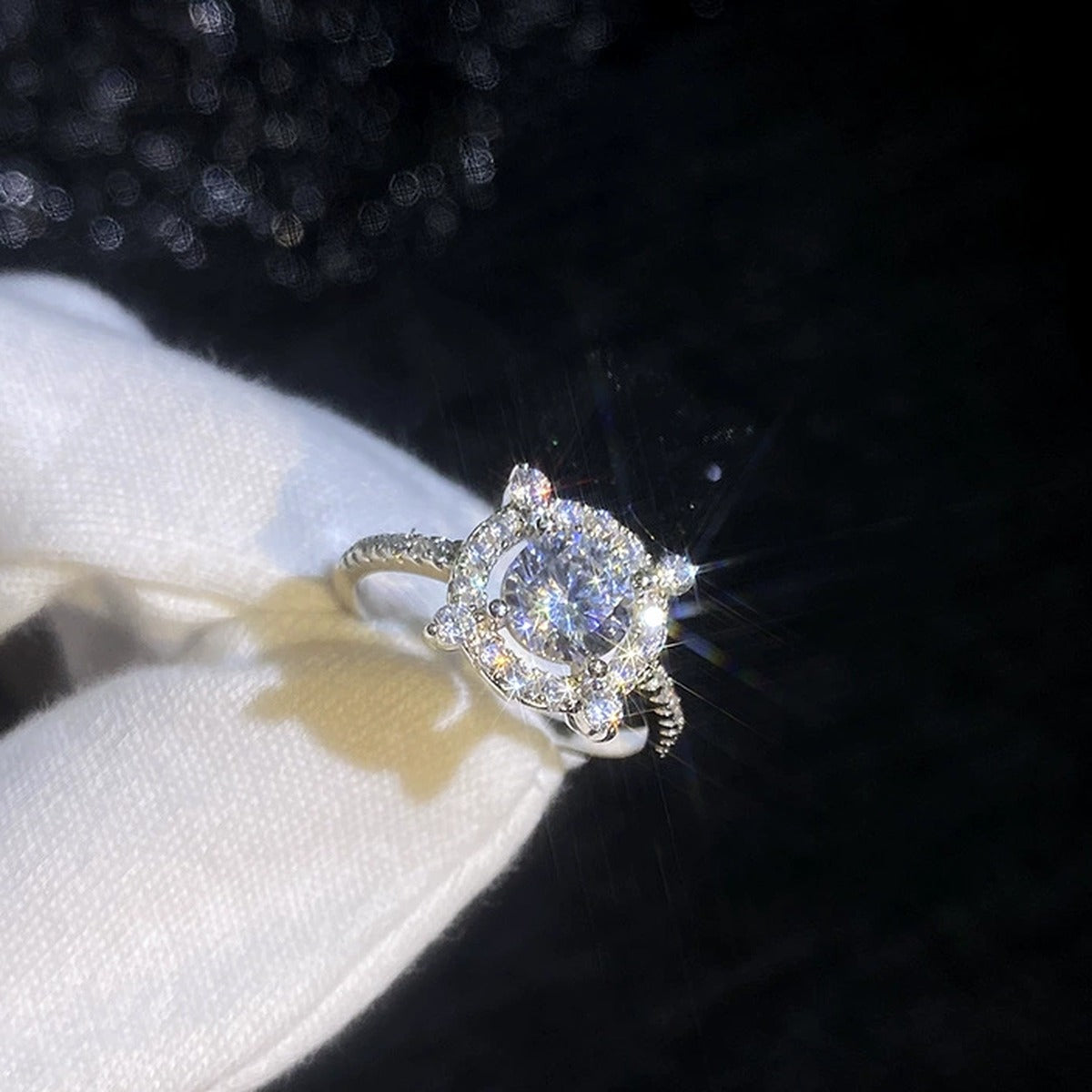 Round Halo Moissanite Ring with CZ dark background detail view