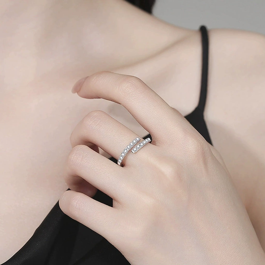 Adjustable Bypass Moissanite Band Ring worn on hand by model