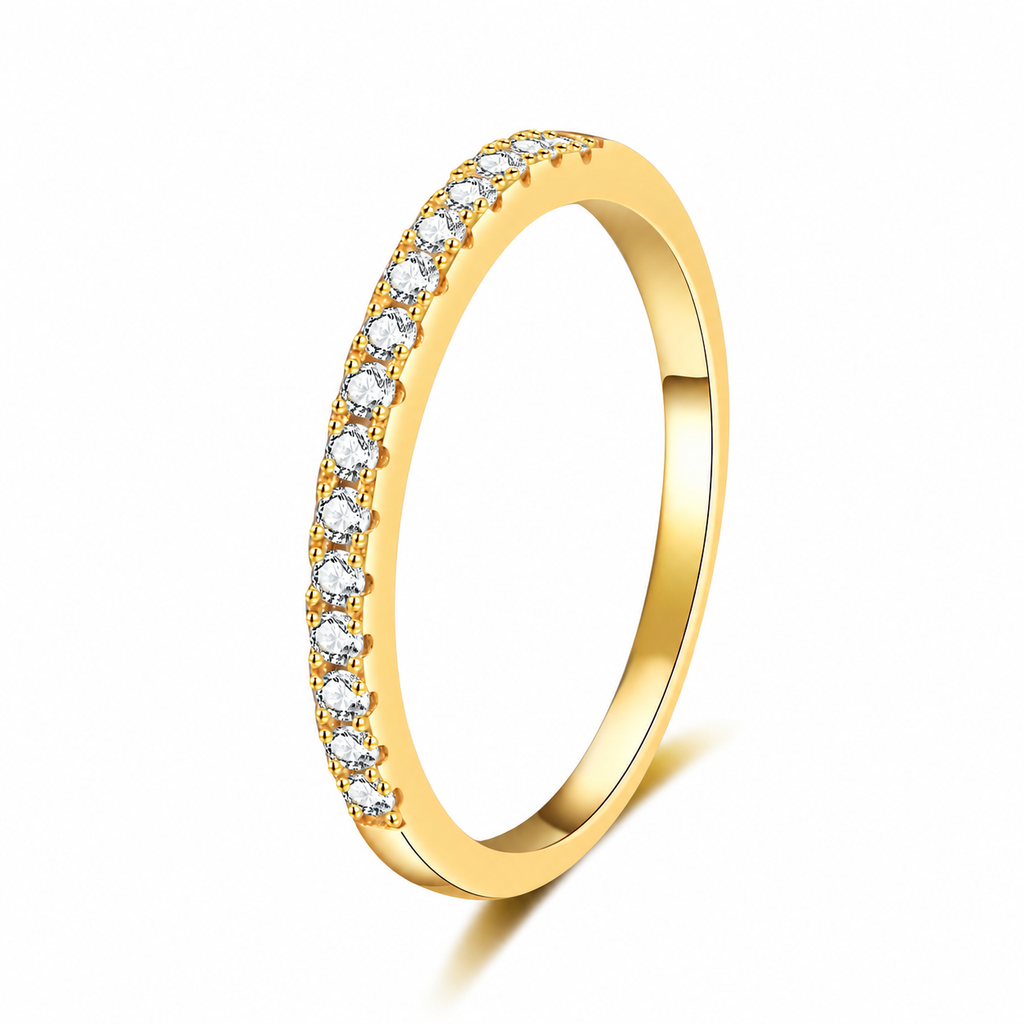 A yellow gold eternity-style ring featuring a single row of round clear gemstones along the outer band, shown on a clean white background with a soft shadow.