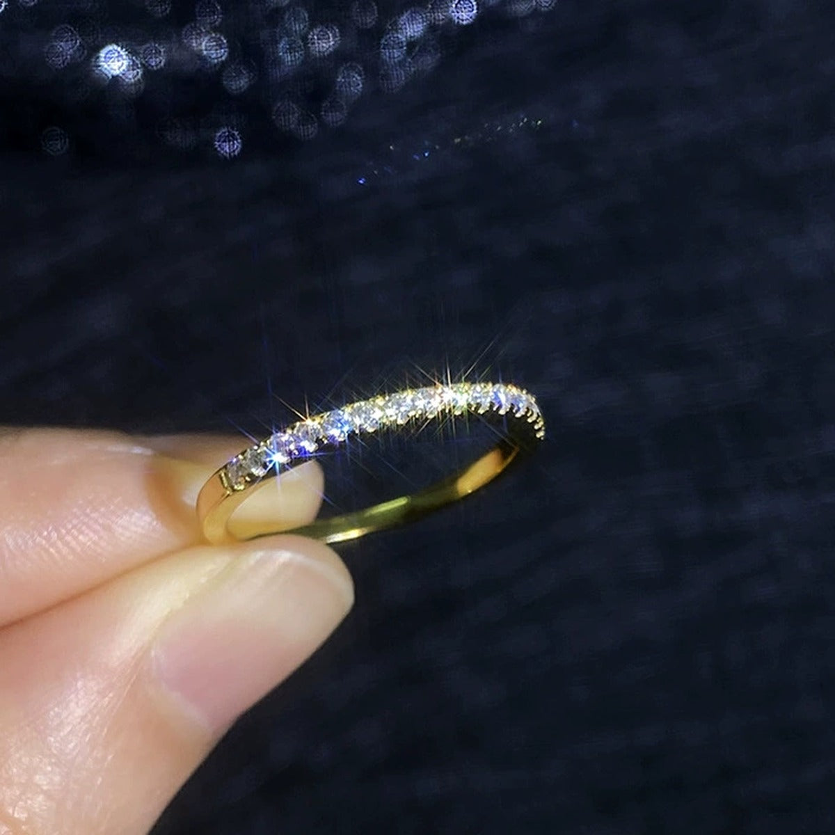 Slim Moissanite Band Ring in Yellow Gold-Plated S925 Sterling Silver dark background detail view