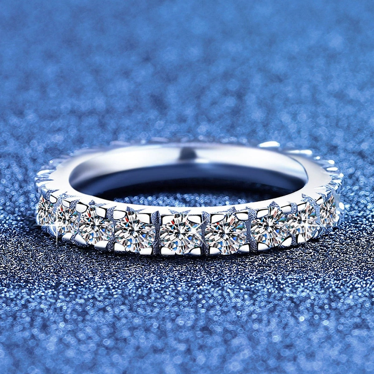 Full Eternity Round Moissanite Band Ring blue background product view