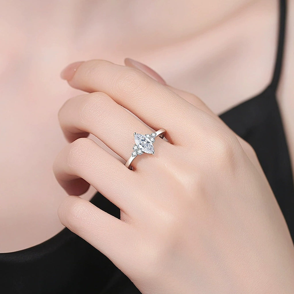 Marquise Moissanite Ring with CZ worn on hand by model