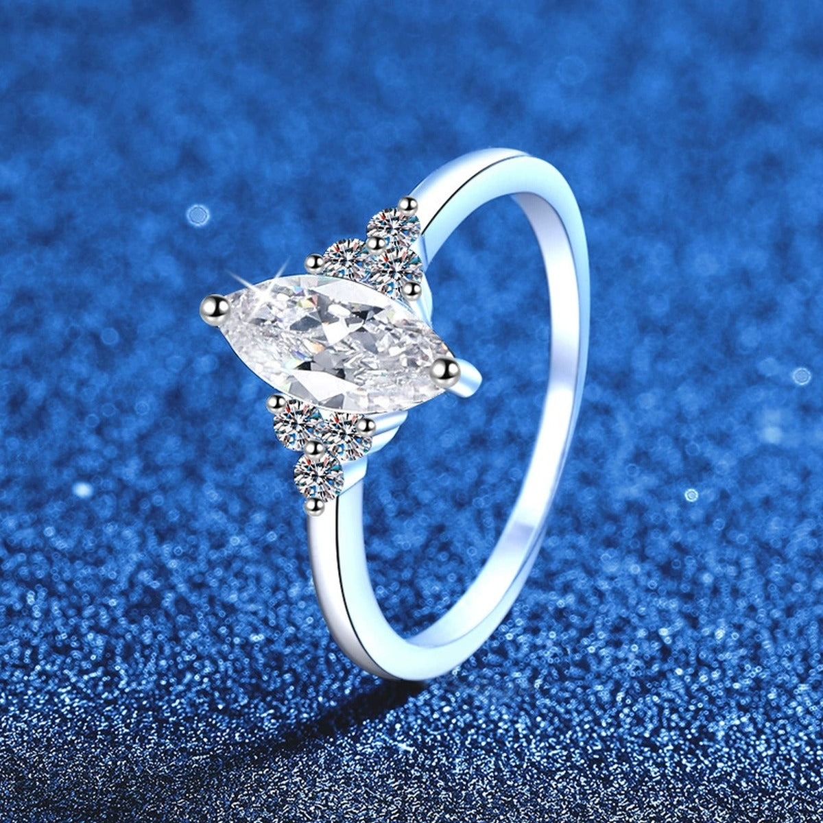 Marquise Moissanite Ring with CZ blue background product view