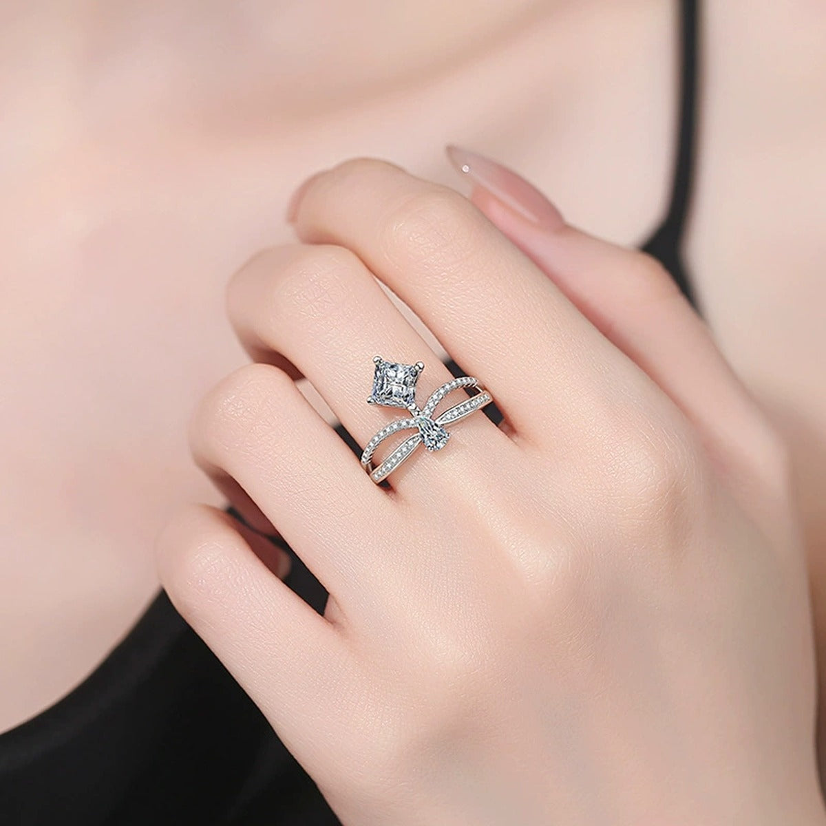 Radiant and Pear Moissanite Ring with CZ worn on hand by model