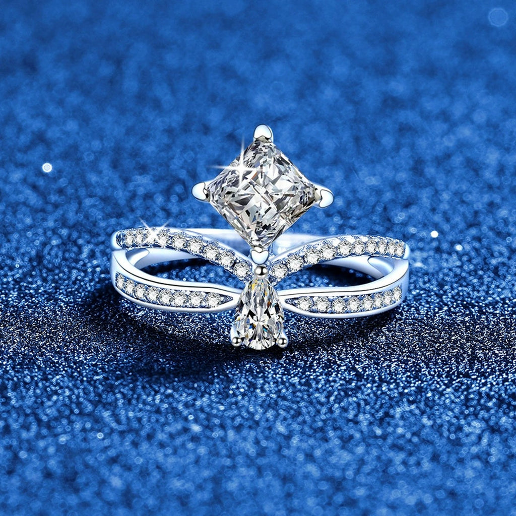 Radiant and Pear Moissanite Ring with CZ blue background product view