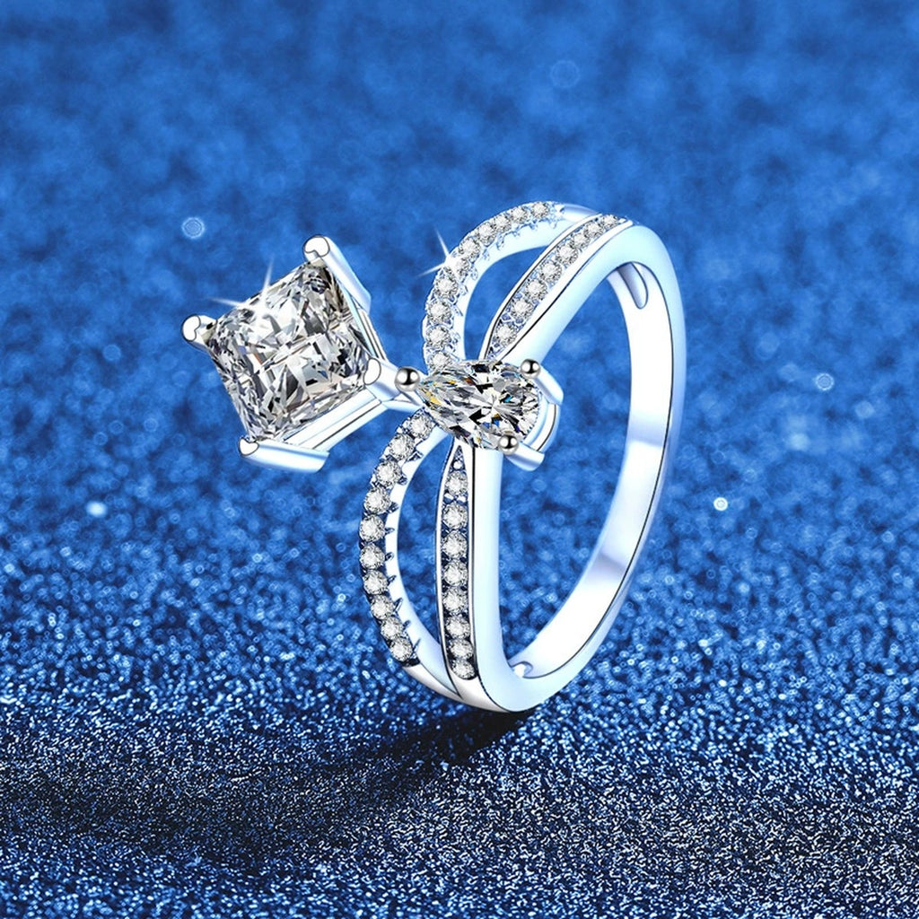 Radiant and Pear Moissanite Ring with CZ blue background product view