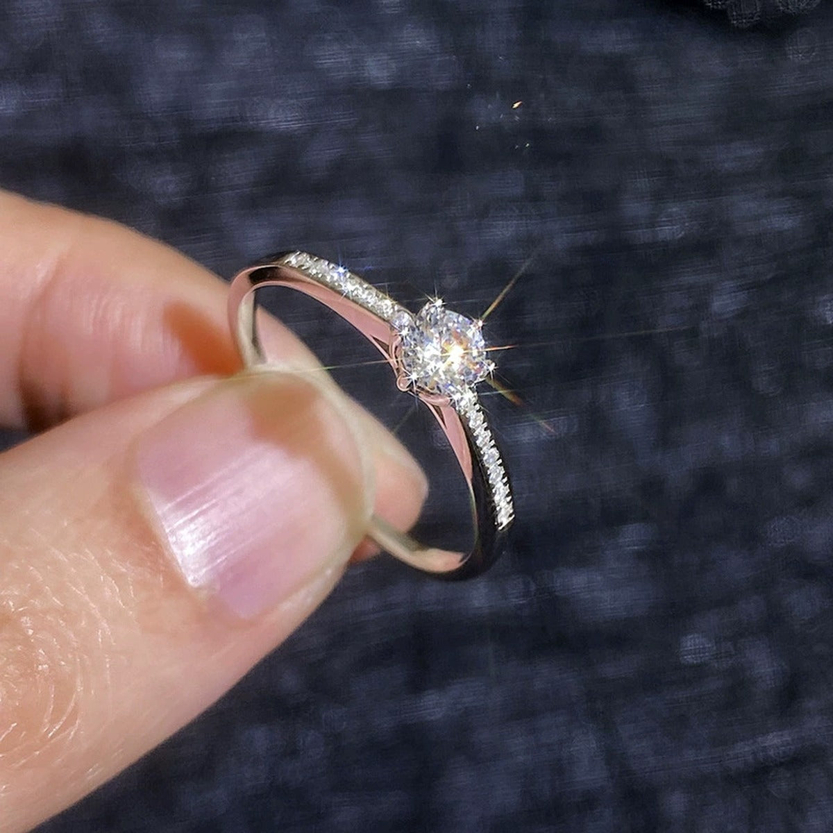 Round Moissanite Ring with CZ blue background product view