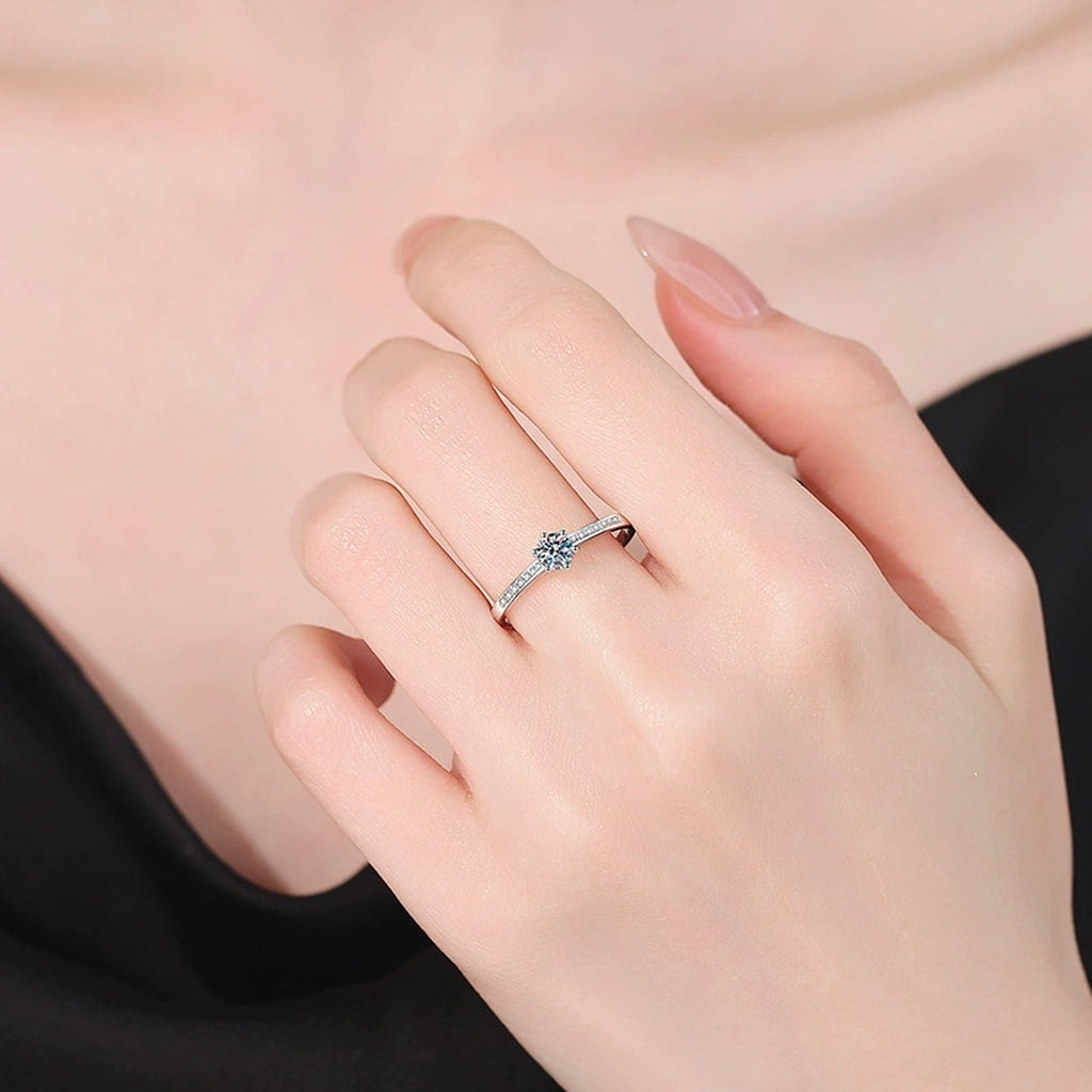 Round Moissanite Ring with CZ worn on hand by model