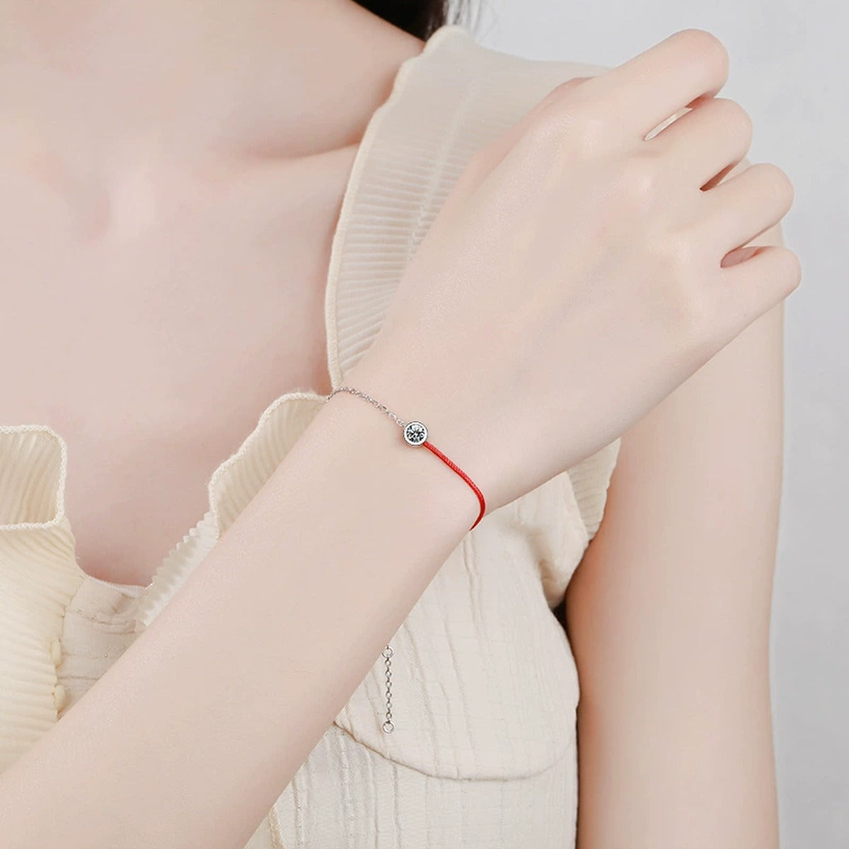 Two-Tone Red Cord Moissanite Adjustable Bracelet in White Gold-Plated S925 Sterling Silver worn on wrist model view showing scale and fit