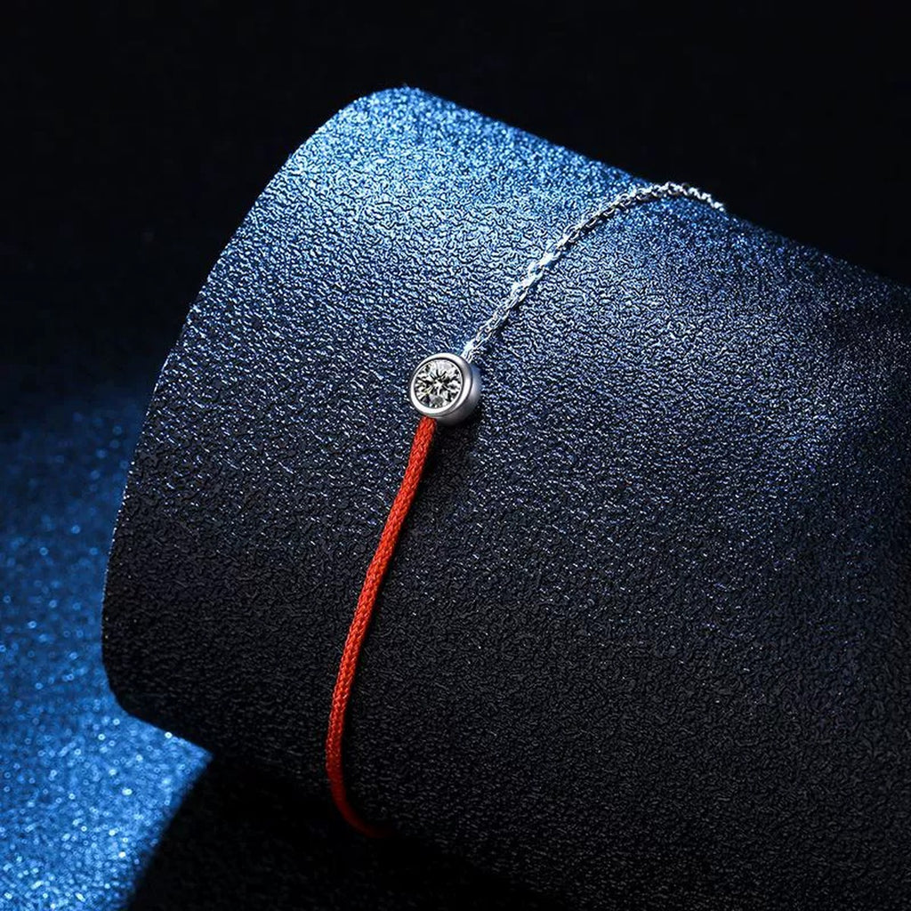Two-Tone Red Cord Moissanite Adjustable Bracelet in White Gold-Plated S925 Sterling Silver blue display scene showing bracelet sparkle and chain detail