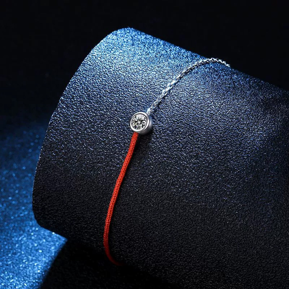 Two-Tone Red Cord Moissanite Adjustable Bracelet in White Gold-Plated S925 Sterling Silver blue display scene showing bracelet sparkle and chain detail