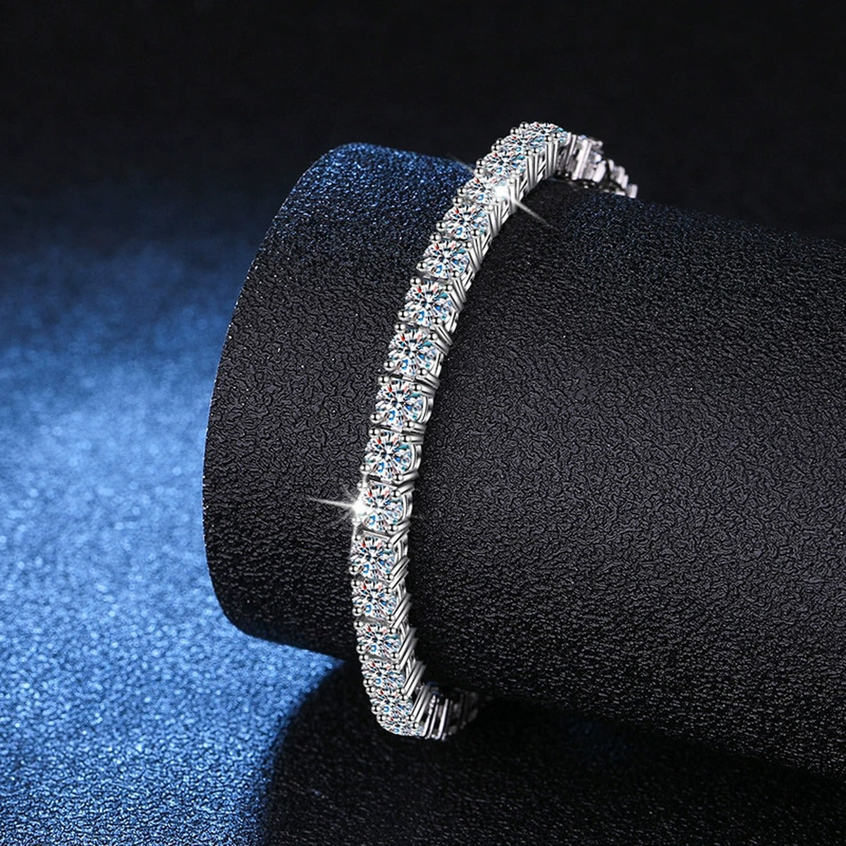 Moissanite Tennis Bracelet in White Gold-Plated S925 Sterling Silver blue display scene showing bracelet sparkle and chain detail